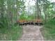 Park setting with gravel walkway and benches for enjoying nature at 9625 E Center Ave # 5C, Denver, CO 80247