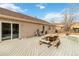 Spacious backyard deck with a picnic table, grill, and storage box, perfect for outdoor entertaining at 1133 Northridge Dr, Erie, CO 80516