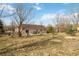 Spacious backyard offers a deck, mature trees, and landscaping, creating a peaceful and inviting outdoor space at 1133 Northridge Dr, Erie, CO 80516