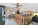 Bright bedroom with desk and wood bed frame, ceiling fan and neutral decor at 1133 Northridge Dr, Erie, CO 80516
