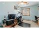 Bedroom showcasing a window, shelving, and ceiling fan, ideal for a home office or guest room setup at 1133 Northridge Dr, Erie, CO 80516