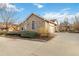 Home with unique stone exterior, a well-maintained yard, and a spacious driveway leading to the garage at 1133 Northridge Dr, Erie, CO 80516