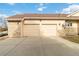 Spacious two-car garage featuring a stone facade and ample driveway space for additional parking at 1133 Northridge Dr, Erie, CO 80516