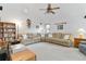 Spacious living room featuring a sectional sofa, high ceilings, and built-in shelving for storage at 1133 Northridge Dr, Erie, CO 80516