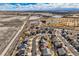 Aerial view of a neighborhood near a golf course, ponds, and open fields, perfect for recreation and relaxation at 8768 Foxfire St, Firestone, CO 80504