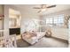 Adorable bedroom with a house-shaped bed frame, a large window, and a connected bathroom at 8768 Foxfire St, Firestone, CO 80504