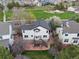 Aerial view of house showing backyard patio, and deck, near a large park at 20650 Parker Vista Cir, Parker, CO 80138