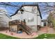 A beautiful backyard featuring a wooden deck, lush green grass, and a multi-level patio for entertaining at 20650 Parker Vista Cir, Parker, CO 80138