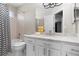 Bathroom featuring a tub with shower, a toilet, and a vanity with sink at 20650 Parker Vista Cir, Parker, CO 80138