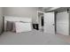 Comfortable bedroom with soft gray bedding, fluffy pillows, barn door access, and neutral decor at 20650 Parker Vista Cir, Parker, CO 80138