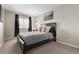 Bedroom featuring a dark wood bed, carpeted floor, a window, and a baseball-themed wall art at 20650 Parker Vista Cir, Parker, CO 80138