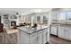 Modern kitchen with granite countertops, stainless steel appliances, and island with bar seating at 20650 Parker Vista Cir, Parker, CO 80138