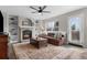 Inviting living room with a brick fireplace, built-in shelving, and a comfortable leather couch at 20650 Parker Vista Cir, Parker, CO 80138