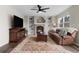 Comfortable living room featuring a brick fireplace, custom built-ins, and a plush leather sofa at 20650 Parker Vista Cir, Parker, CO 80138