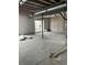 Unfinished basement with concrete floors and walls, offering potential for a customized living space at 6709 Juniper Dr, Thornton, CO 80602