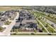 Stunning aerial view of a home with solar panels, back patio, and landscaping in a vibrant neighborhood at 9741 Taylor River Cir, Littleton, CO 80125