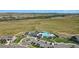 Aerial view of the community clubhouse, pool, and surrounding open space at 9741 Taylor River Cir, Littleton, CO 80125