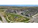 Aerial view of a Primary-planned community featuring green spaces, walking trails, and modern homes at 9741 Taylor River Cir, Littleton, CO 80125