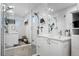 Clean, modern bathroom featuring a glass-enclosed shower, sleek fixtures, and a white vanity with ample storage at 9741 Taylor River Cir, Littleton, CO 80125