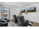 Spacious game room with comfortable seating, large screen TVs, and contemporary design at 9741 Taylor River Cir, Littleton, CO 80125