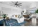 Inviting living room adjacent to the dining area features a modern sofa and decor at 9741 Taylor River Cir, Littleton, CO 80125