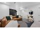 Spacious living room featuring stylish seating, modern rug, and contemporary decor for comfortable living at 9741 Taylor River Cir, Littleton, CO 80125