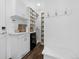 Well-organized mud room with built-in storage, coat hooks, and a bench for convenience at 9741 Taylor River Cir, Littleton, CO 80125