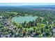 Stunning aerial view showcases neighborhood, lake, parks, and greenery for outdoor enjoyment and recreation at 444 S Pearl St, Denver, CO 80209