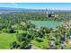 Gorgeous aerial view with the lake and parks surrounded by lush greenery, and city skyline in the background at 444 S Pearl St, Denver, CO 80209