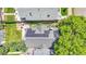 The aerial view reveals a backyard patio and solar panels on the roof at 444 S Pearl St, Denver, CO 80209