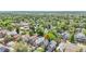 Expansive aerial view captures the density of the neighborhood amid a sea of trees and nearby commercial districts at 444 S Pearl St, Denver, CO 80209