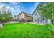 Beautiful backyard with lush green lawn, a stone patio and plenty of space for outdoor entertaining at 444 S Pearl St, Denver, CO 80209