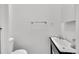 A bright half bathroom features a stylish sink and toilet, providing a functional and aesthetically pleasing space at 444 S Pearl St, Denver, CO 80209