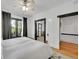 Bright bedroom featuring a ceiling fan, white walls and access to additional rooms at 444 S Pearl St, Denver, CO 80209