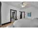 Bright bedroom featuring a ceiling fan, a walk-in closet, and soft carpet at 444 S Pearl St, Denver, CO 80209