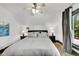 Bright, airy bedroom featuring a ceiling fan, and two night stands at 444 S Pearl St, Denver, CO 80209