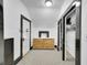 Hallway features carpet, modern storage and black trim throughout the doors at 444 S Pearl St, Denver, CO 80209