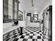 Eat-in kitchen with black and white tile floor, classic black cabinets and stainless steel appliances at 444 S Pearl St, Denver, CO 80209