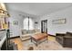 Bright and airy living room with hardwood floors, comfortable seating, fireplace, and abundant natural light at 444 S Pearl St, Denver, CO 80209