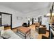 Spacious living room with hardwood floors, fireplace, stylish furniture, and natural light at 444 S Pearl St, Denver, CO 80209