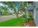 Charming street view with tree-lined sidewalks and beautiful homes with front porches and well-kept lawns at 444 S Pearl St, Denver, CO 80209
