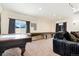 Basement features pool table and shuffleboard at 9965 E 143Rd Way, Brighton, CO 80602