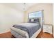 Bedroom with hardwood floors and a window at 9965 E 143Rd Way, Brighton, CO 80602