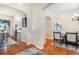 Dining area with hardwood floors and adjacent kitchen at 9965 E 143Rd Way, Brighton, CO 80602