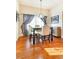 Formal dining room with hardwood floors and stained glass light at 9965 E 143Rd Way, Brighton, CO 80602