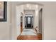 Elegant entryway with hardwood floors and black door at 9965 E 143Rd Way, Brighton, CO 80602