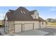 House exterior, three-car garage, stone accents at 9965 E 143Rd Way, Brighton, CO 80602