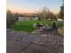 Landscaped front yard with mature trees and rock features at 9965 E 143Rd Way, Brighton, CO 80602