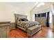 Bright main bedroom with hardwood floors and ample space for furniture at 9965 E 143Rd Way, Brighton, CO 80602
