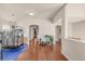 Bright hallway with hardwood floors and access to bedrooms at 9965 E 143Rd Way, Brighton, CO 80602